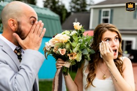 After their wedding recessional at a private residence on Orr's Island, Maine, the couple shares a tearful moment following their vows.